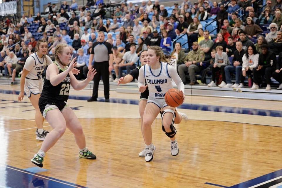 CBC’s Lexie Heath is surrounded by Green River defenders during Saturday’s community college women’s basketball semifinals at CBC.