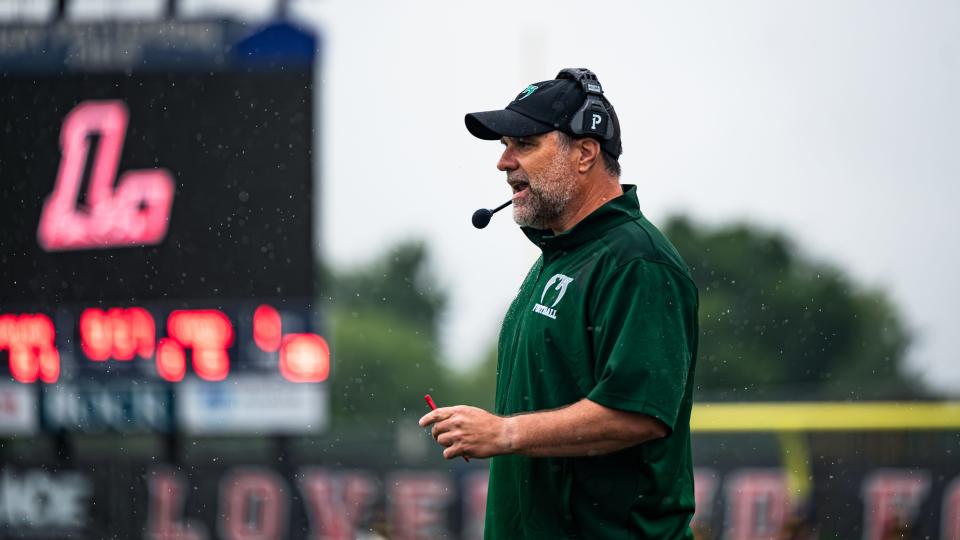 New Fossil Ridge Sabercats head coach Chris Tedford directs his players through the season opener vs. Loveland at Ray Patterson Field in Loveland on Friday, Aug. 25, 2023.