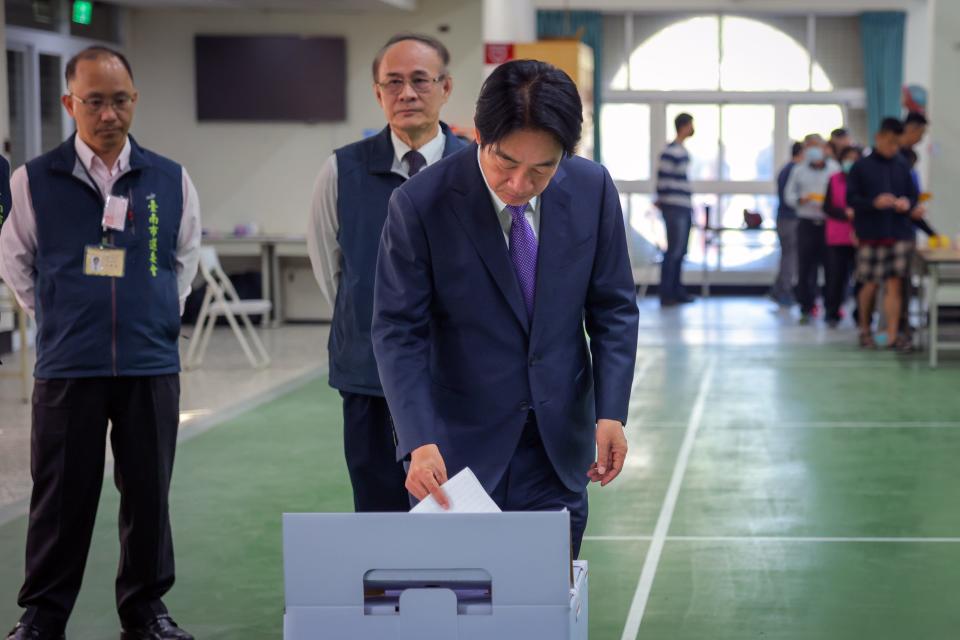 Taiwan's Vice President and presidential candidate for the ruling Democratic Progressive Party (DPP) Lai Ching-te (C) casts his ballot to vote on January 13, 2024, in Tainan, Taiwan.