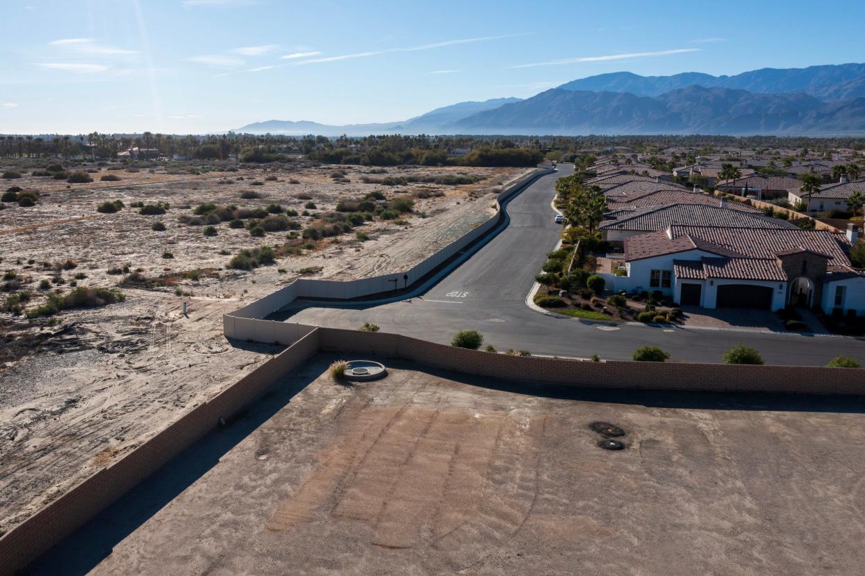Haflinger Way inside the gated community known as Griffin Ranch is next to undeveloped land off Avenue 54 in La Quinta. A developer has halted for now plans to build 78 single-family homes, which would operate as short-term rentals, on the open land.