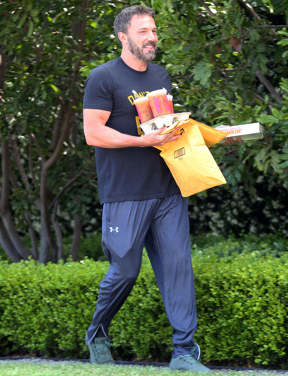 <p>A smiling Ben Affleck grabs his Dunkin and the mail on Saturday morning in Los Angeles. </p>