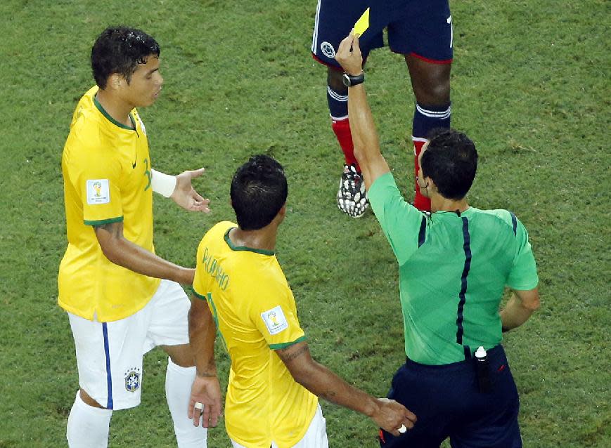 Brazil&#39;s Thiago Silva gets a yellow card during the World Cup quarterfinal soccer match between Brazil and Colombia at the Arena Castelao in Fortaleza, Brazil, Friday, July 4, 2014. (AP Photo/Fabrizio Bensch, pool)