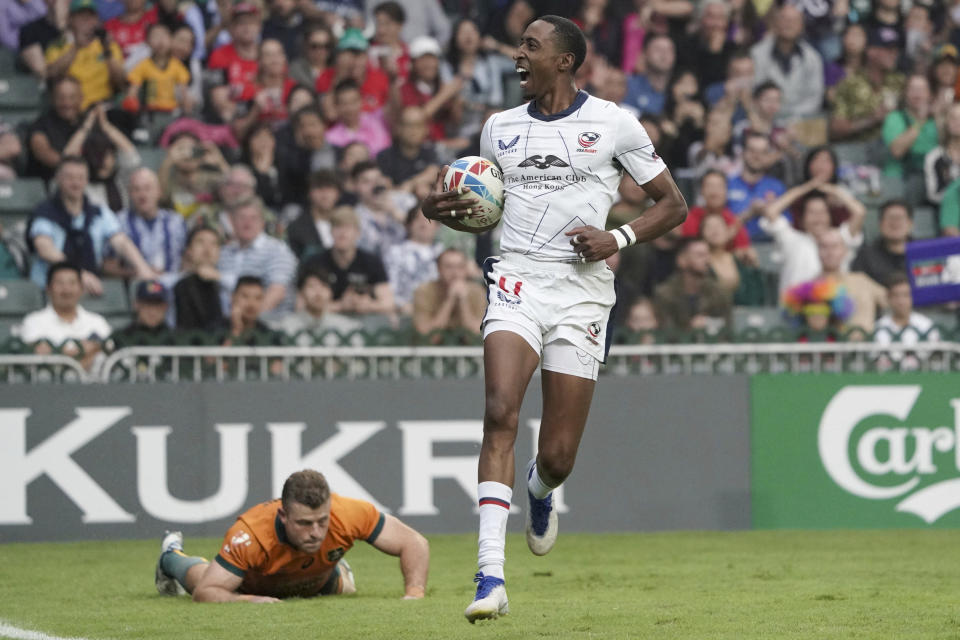 FILE - Perry Baker of the United States reacts after scoring a try against Australia during the second day of the Hong Kong Sevens rugby tournament in Hong Kong, Saturday, April 1, 2023. The US hasn't won an Olympic medal in rugby sevens since the sport was introduced in 2016. (AP Photo/Anthony Kwan, File)