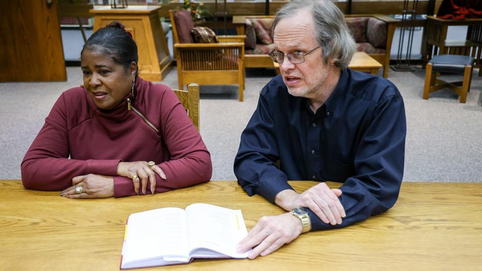 Claudia Stuart and Dr. Marty Kuhlman chat in West Texas A&M University's Cornette Library, which has compiled a resource guide for people researching Black life in Amarillo.