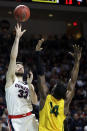 Gonzaga's Killian Tillie (33) shoots as San Francisco's Charles Minlend defends during the first half of an NCAA college basketball game in the West Coast Conference men's tournament Monday, March 9, 2020, in Las Vegas. (AP Photo/Isaac Brekken)