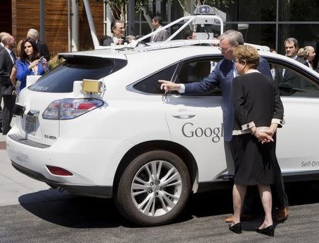 Google Executive Chairman Eric Schmidt (2nd R) shows Brazil President Dilma Rousseff (R) a self-driving car at Google Headquarters in Mountain View, California, in this July 1, 2015 file photo. REUTERS/Beck Diefenbach