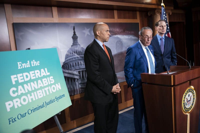 Senate Majority Leader Chuck Schumer, D-N.Y., (M) speaks during a news conference to call for the decriminalization of marijuana at the federal level at the U.S. Capitol in 2021. To Schumer's right, Sen. Ron Wyden, D-Ore., and New Jersey's Democratic Sen. Cory Booker. File Photo by Sarah Silbiger/UPI