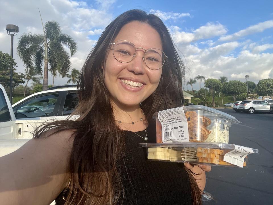 Ashley carrying some snacks to the beach