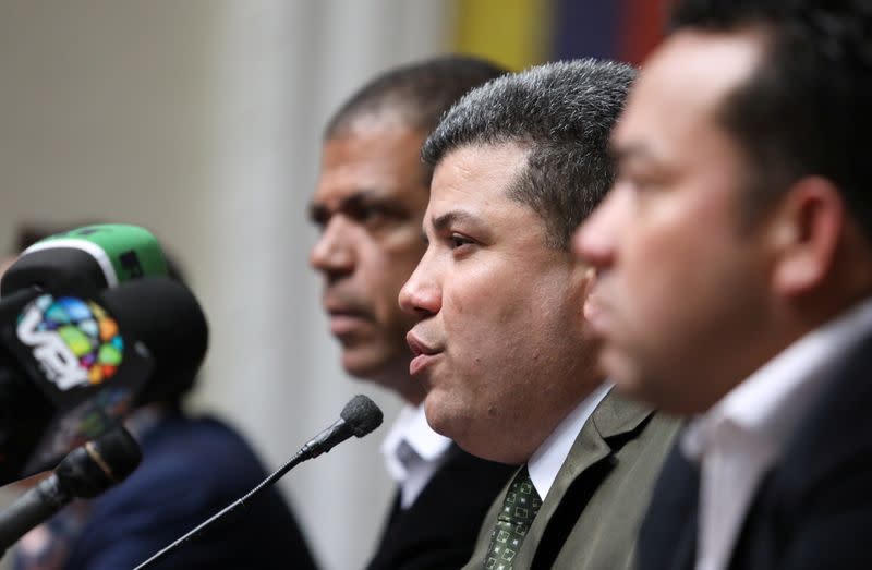 Venezuelan lawmaker Luis Parra speaks during a news conference in Caracas