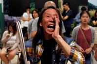 A woman reacts during the counting of the votes of the Hong Kong council elections