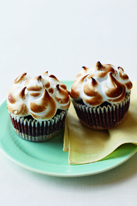 <p>These cupcakes have a graham cracker and chocolate crust, layered with chocolate cake, and topped with fluffy marshmallow topping.</p><p><em><a href="https://www.womansday.com/food-recipes/food-drinks/recipes/a11227/smore-cupcakes-recipe-122601/" rel="nofollow noopener" target="_blank" data-ylk="slk:Get the S'more Cupcakes recipe.;elm:context_link;itc:0;sec:content-canvas" class="link "><strong>Get the S'more Cupcakes recipe.</strong></a></em></p>