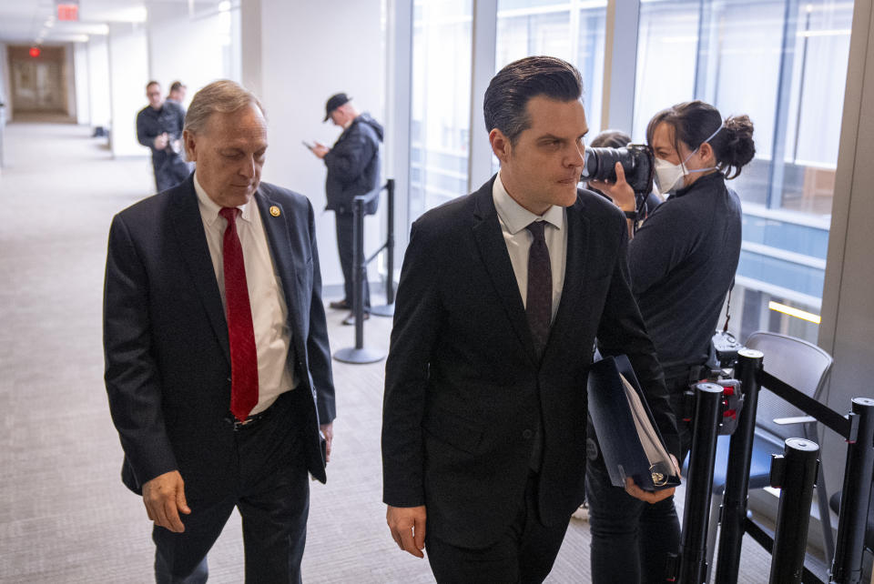 Rep. Andy Biggs, R-Ariz., left, and Rep. Matt Gaetz, R-Fla., right, arrive for a private interview with James Biden, the brother of President Joe Biden, at Thomas P. O'Neill House Office Building on Capitol Hill in Washington, Wednesday, Feb. 21, 2024. (AP Photo/Andrew Harnik)