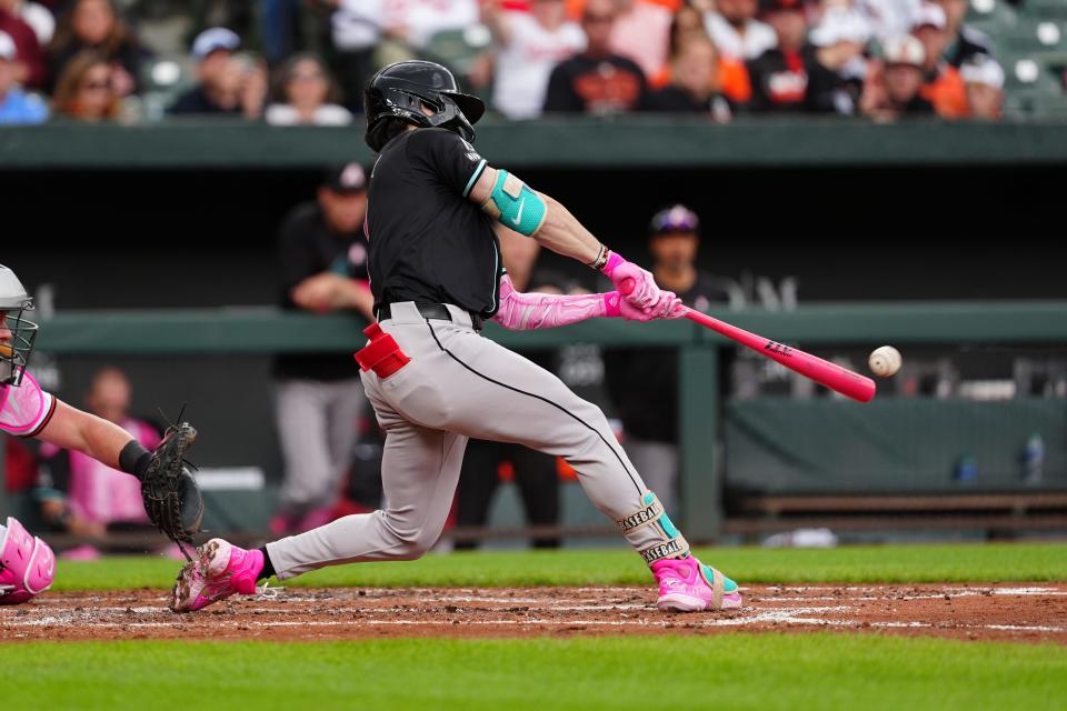 Arizona Diamondbacks center fielder Corbin Carroll (7) hits a double against the Baltimore Orioles during the fourth inning at Oriole Park at Camden Yards in Baltimore on May 12, 2024.