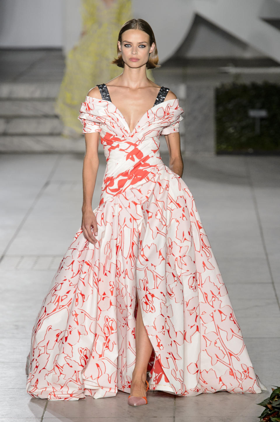 <p><i>Model wears a red-and-white print ball gown from the SS18 Carolina Herrera collection. (Photo: IMAXtree) </i></p>