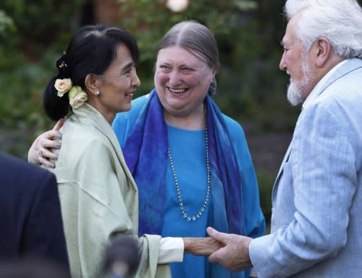Myanmar democracy icon Aung San Suu Kyi (L) meets with old friends at a reception at St Hugh's College in Oxford. Suu Kyi made an emotional return to Britain on her 67th birthday Tuesday, visiting her former home of Oxford and speaking of the "sacrifice" her family were forced to make