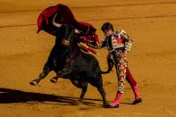 <p>Bullfighter Julian Lopez ‘El Juli’ performs with a Daniel Ruiz ranch fighting bull at La Maestranza bullring on the second day of La feria de Abril (April’s Fair) in Seville, Spain. (David Ramos/Getty Images) </p>