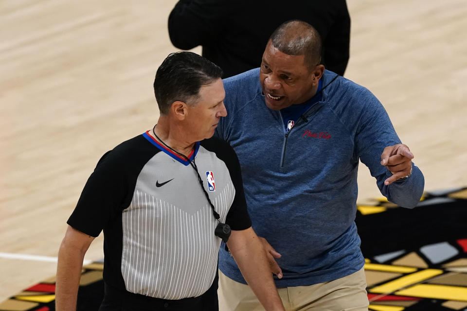 Philadelphia 76ers head coach Doc Rivers, right, argues with an official during the first half of Game 6 of an NBA basketball Eastern Conference semifinal series against the Atlanta Hawks, Friday, June 18, 2021, in Atlanta. (AP Photo/John Bazemore)
