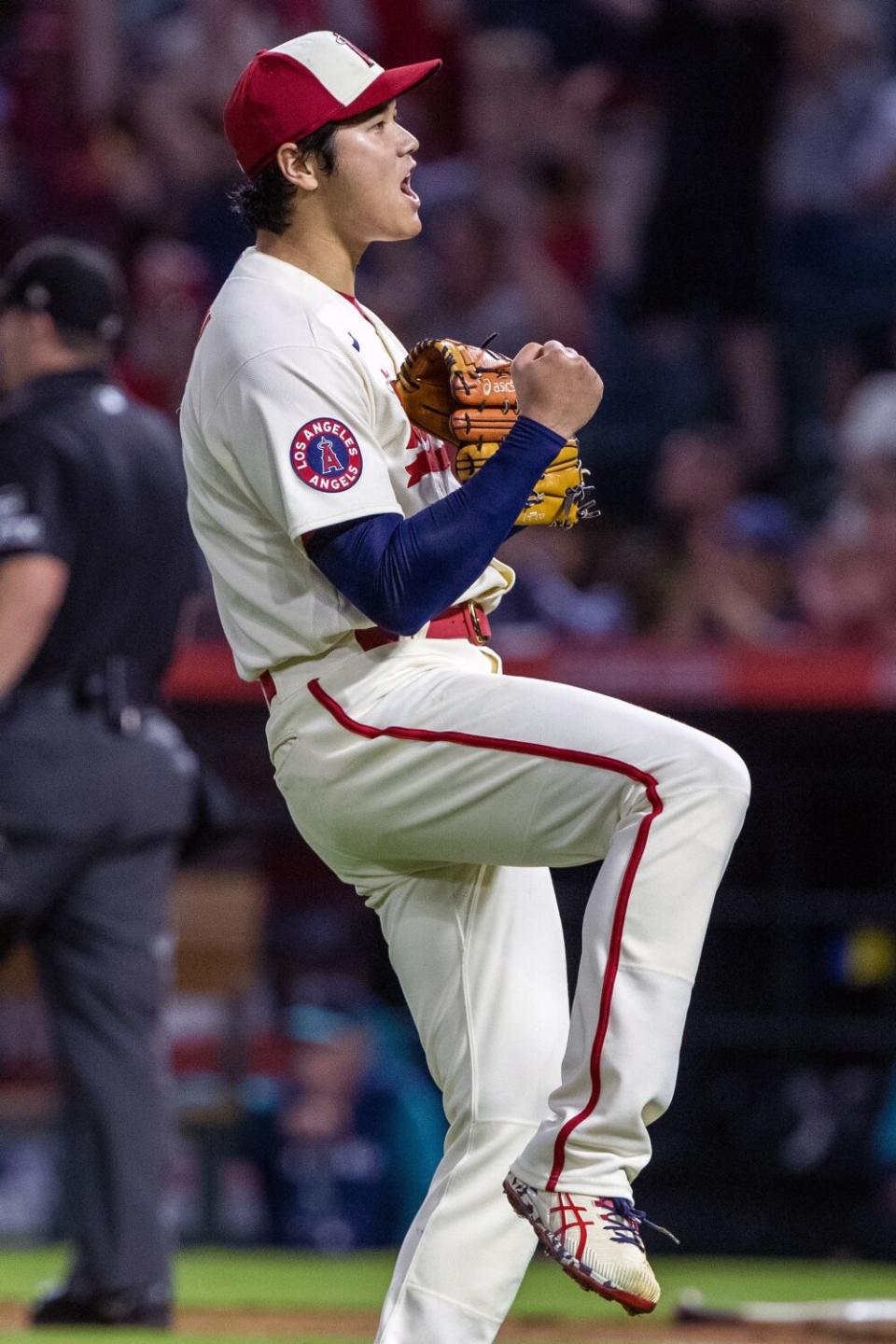 Angels pitcher Shohei Ohtani reacts after the Mariners' Adam Frazier grounded into a double play during the seventh inning.