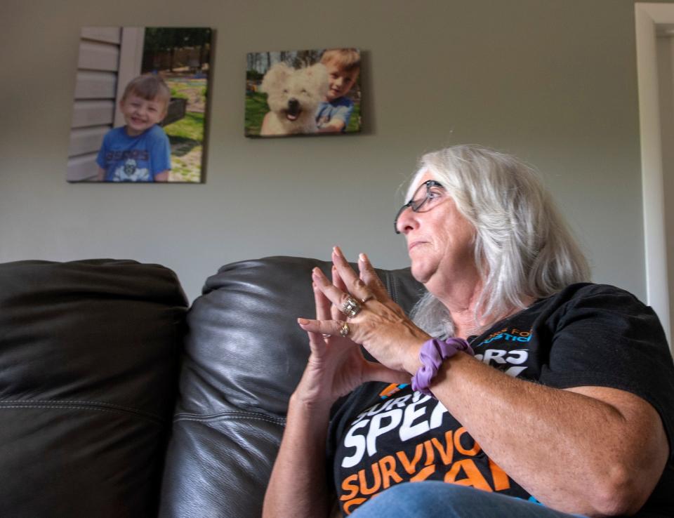 Pearl Wise describes finding her voice in as a survivor. Behind her on the wall of her living room are photos of her grandson Layton, who she is raising after her son's murder in 2018.