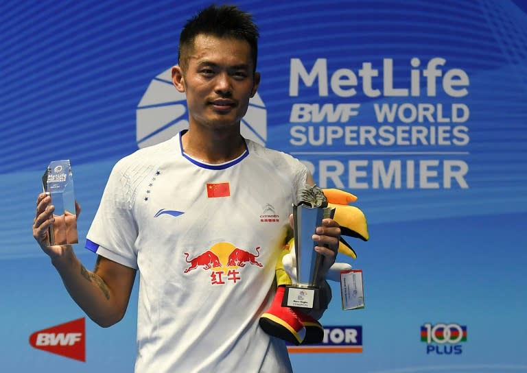 Lin Dan of China poses with his trophy following his men's singles final victory over Lee Chong Wei of Malaysia at the Malaysia Open Badminton Superseries in Kuching on April 9, 2017