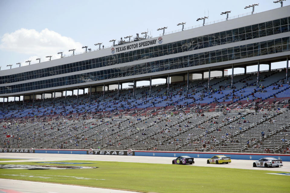 The grandstand is viewed at Texas Motor Speedway during a NASCAR Cup Series auto race in Fort Worth, Texas, Sunday, July 19, 2020. (AP Photo/Ray Carlin)