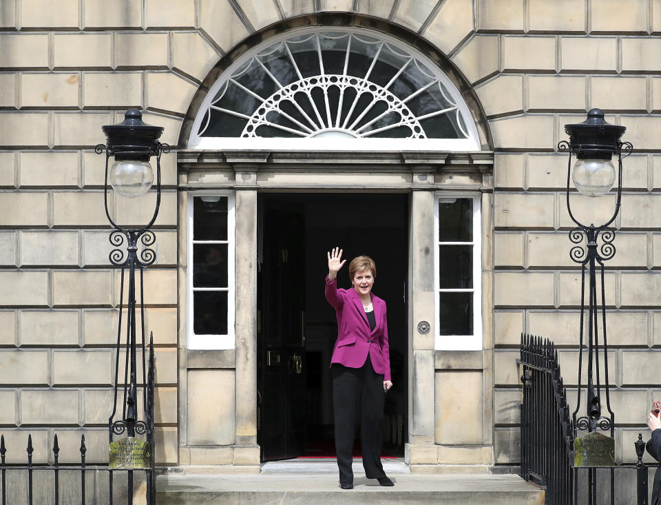 Scotland's First Minister and Scottish National Party leader Nicola Sturgeon poses for photographers, at Bute House in Edinburgh, Scotland. Sunday, May 9, 2021. British Prime Minister Boris Johnson has invited the leaders of the U.K.’s devolved nations for crisis talks on the union after Scotland’s pro-independence party won its fourth straight parliamentary election. Sturgeon said the election results proved a second independence vote for Scotland was “the will of the country." She said any London politician who stood in the way would be “picking a fight with the democratic wishes of the Scottish people.” (AP Photo/Scott Heppell)