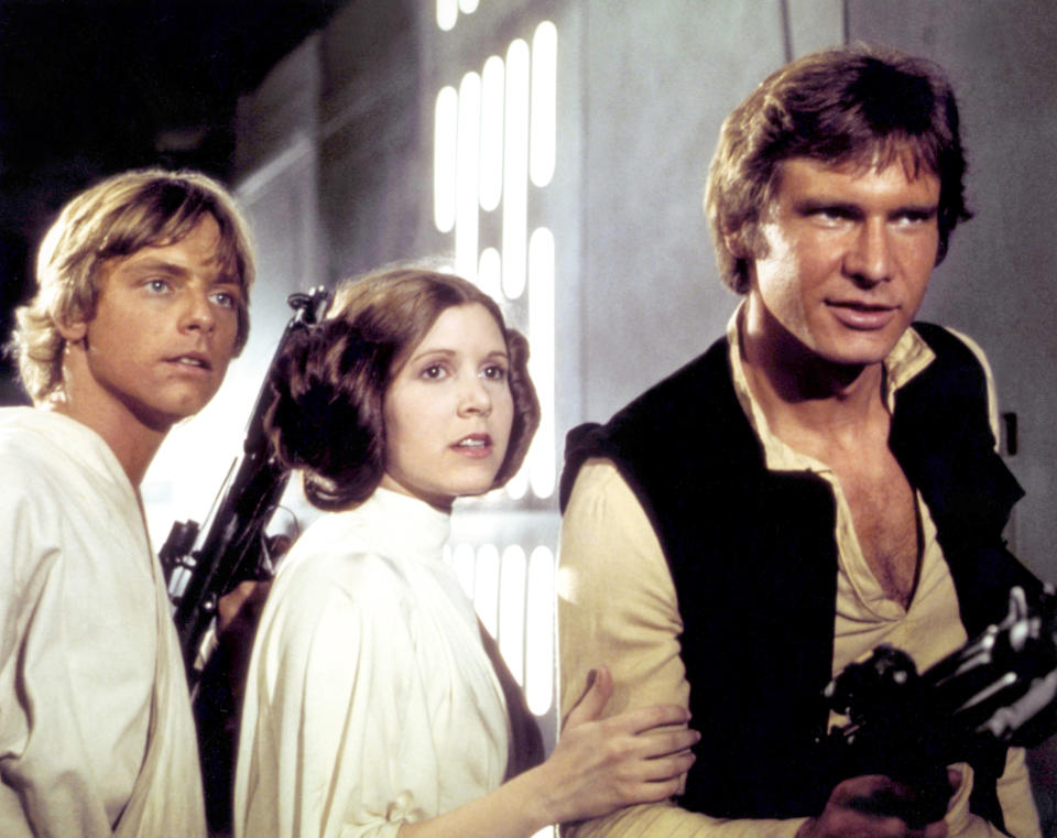 Mark Hamill, Carrie Fisher and Harrison Ford, pictured on the set of "Star Wars," owe their look in part to John Mollo. (Photo: Sunset Boulevard via Getty Images)