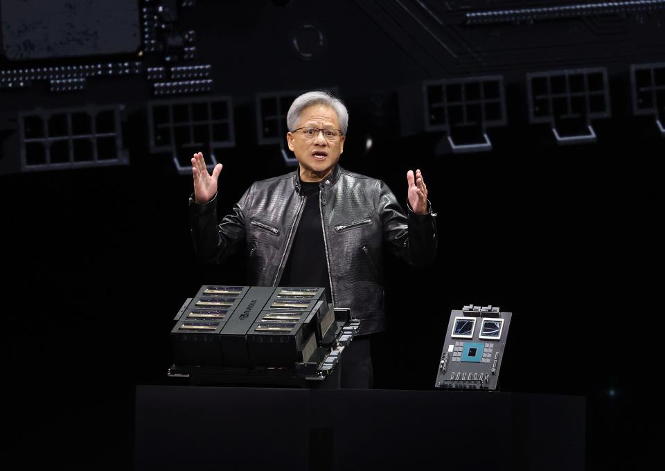 Jensen Huang presenting chips onstage.