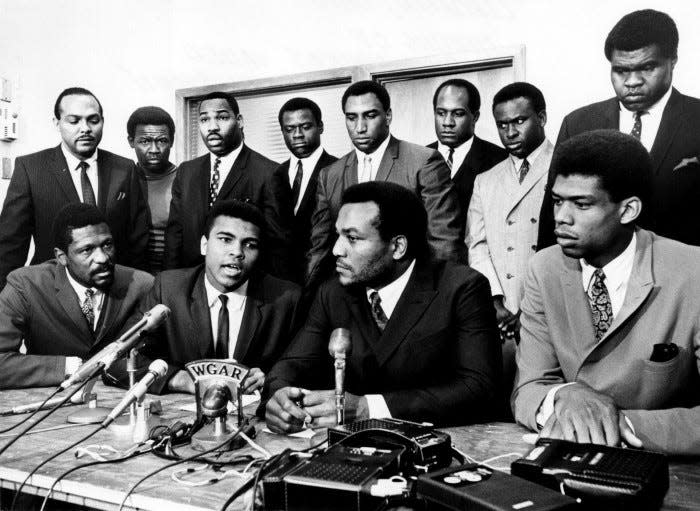 Former Cleveland Browns Hall of Fame running back Jim Brown presides over a meeting of top African-American athletes who supported boxer Muhammad Ali's refusal to fight in Vietnam on June 4, 1967.  Pictured: (front row) Bill Russell, Muhammad Ali, Jim Brown, Lew Alcindor; (back row) Carl Stokes, Walter Beach, Bobby Mitchell, Sid Williams, Curtis McClinton, Willie Davis, Jim Shorter, and John Wooten. AP Photo/Tony Tomsic
