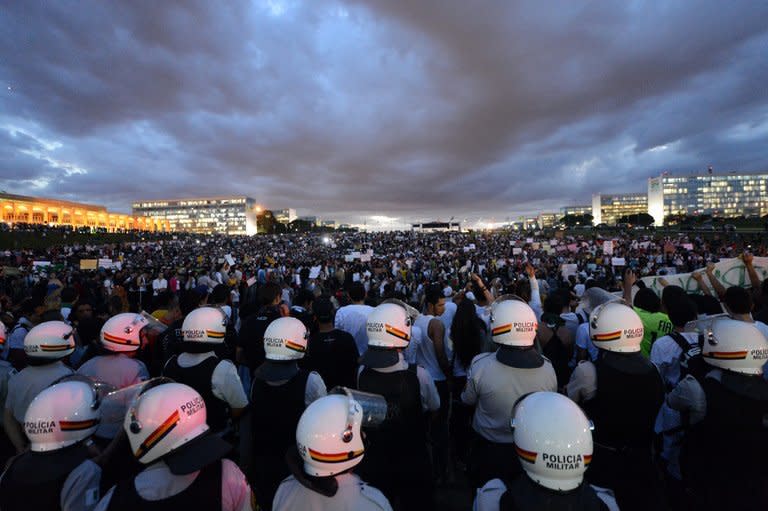 Students shout slogans during a protest on June 17, 2013 in Brasilia. More than 200 youths briefly occupied the roof of the National Congress in Brasilia