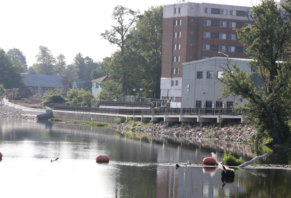 Workers continue construction on the Mishawaka Riverwalk extension from Race Street to Cedar Street on Wednesday, Aug. 2, 2023. Plans are for the project to be done by the end of October.