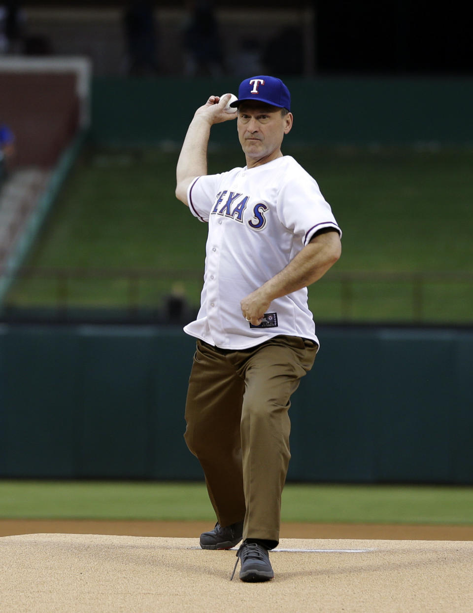 United States Supreme Court Associate Justice Samuel A. Alito, Jr. throws out the ceremonial pitch before a baseball game between the Oakland Athletics and Texas Rangers Wednesday, June 19, 2013, in Arlington, Texas. (AP Photo/Tony Gutierrez)