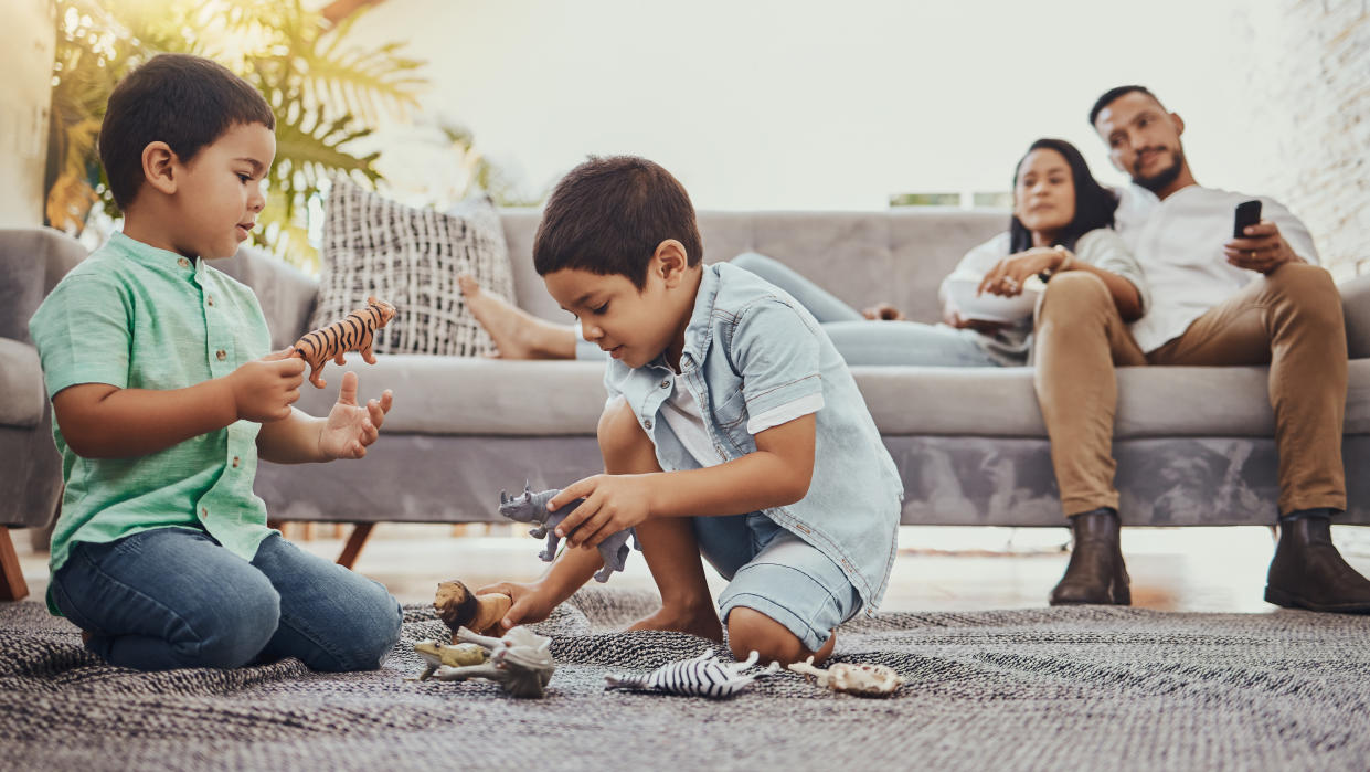 Parents with two kids playing