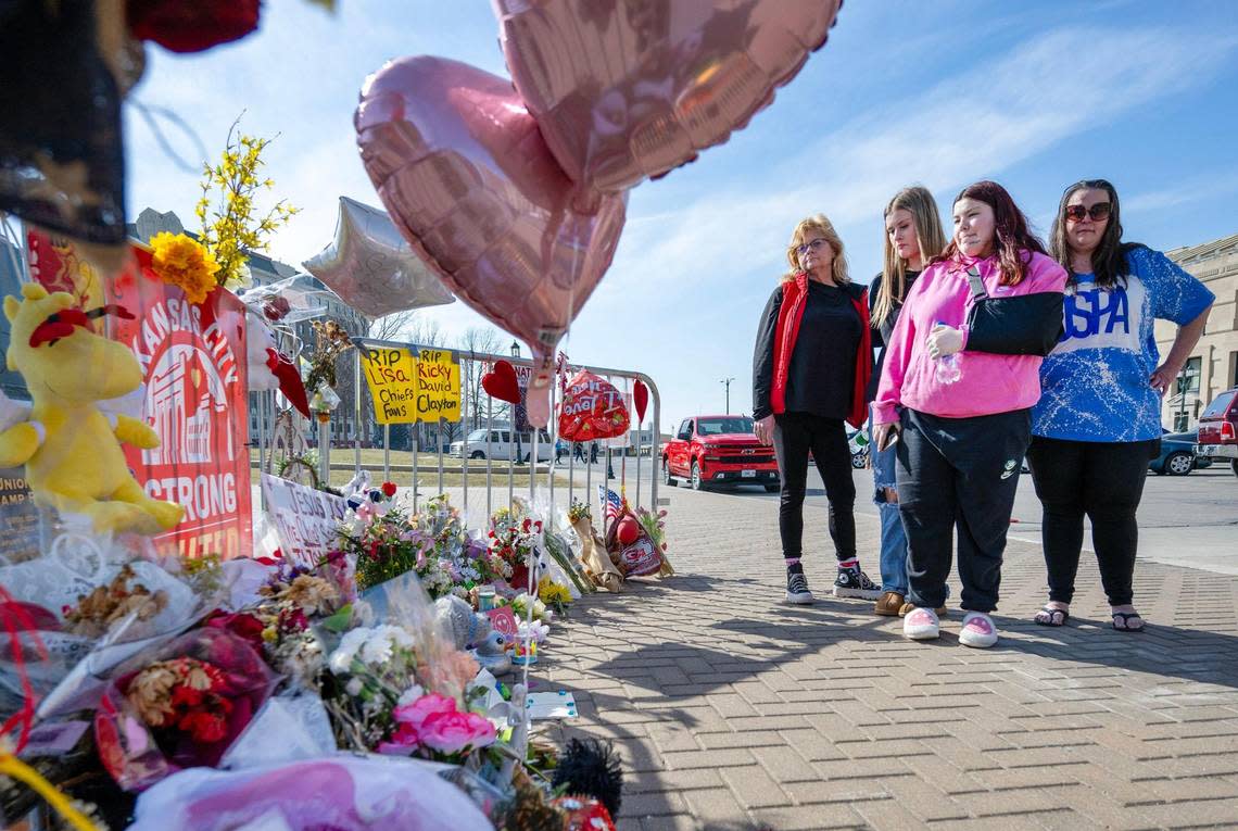 Mireya Nelson, 15, of Belton, Missouri, center, visited the memorial for shooting victims Wednesday at Union Station in Kansas City. Her arm was in a sling after sustaining a gunshot wound during the Chiefs Super Bowl rally last week. Accompanying her were Stephanie Lickteig, her best friend, Samantha Lickteig (also 15), and Mireya’s mother, Erika Nelson.