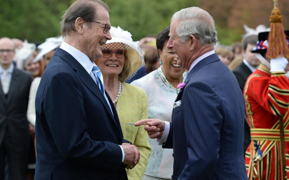 Roger Moore with Prince Charles - Credit:  Getty Images Europe