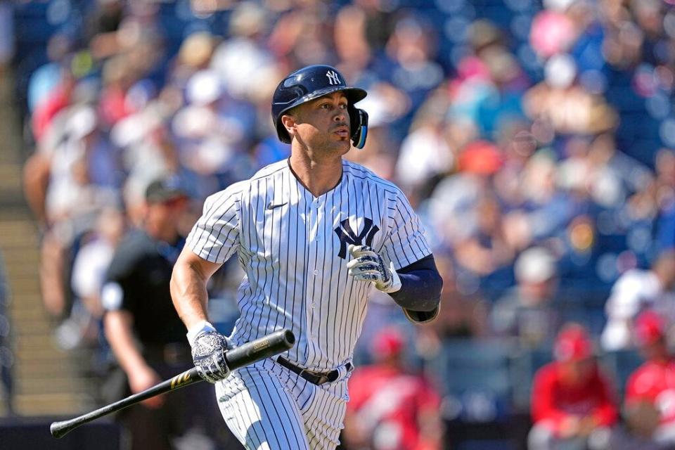 New York Yankees'  Giancarlo Stanton watches his fly ball out against the Washington Nationals during the fourth a spring training baseball game Wednesday, March 1, 2023, in Tampa, Fla.  (AP Photo/David J. Phillip)