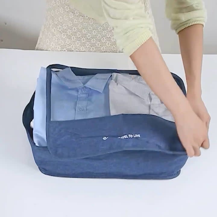 Model with a blue packing cube