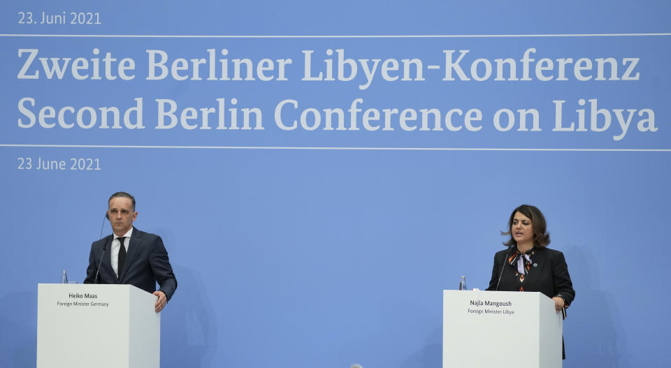 German Foreign Minister Heiko Maas, left, and Libyan Foreign Minister Najla Mangoush address the media during a joint press conferences part of the 'Second Berlin Conference on Libya' at the foreign office in Berlin, Germany, Wednesday, June 23, 2021. (AP Photo/Michael Sohn, pool)