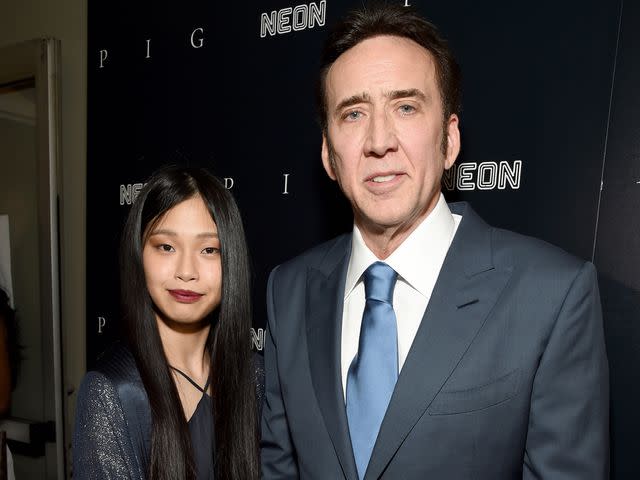 <p>Michael Kovac/Getty</p> Riko Shibata and Nicolas Cage on July 13, 2021