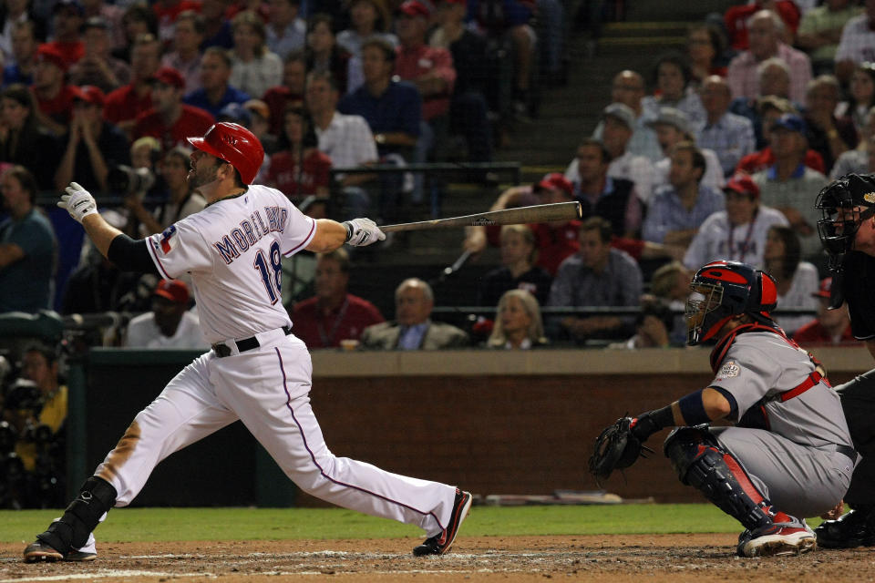 ARLINGTON, TX - OCTOBER 24: Mitch Moreland #18 of the Texas Rangers hits a solo home run in the third inning during Game Five of the MLB World Series against the St. Louis Cardinals at Rangers Ballpark in Arlington on October 24, 2011 in Arlington, Texas. (Photo by Tom Pennington/Getty Images)