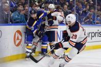 Mar 19, 2019; St. Louis, MO, USA; St. Louis Blues defenseman Alex Pietrangelo (27) clears the puck past Edmonton Oilers center Leon Draisaitl (29) during the second period at Enterprise Center. Mandatory Credit: Jeff Curry-USA TODAY Sports