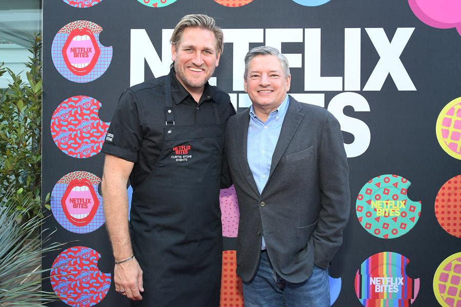 (Left to Right) Chef Curtis Stone and Netflix co-CEO Ted Sarandos attend the opening night of Netflix Bites at Short Stories Hotel in Los Angeles. (Charley Gallay/Getty Images for Netflix)