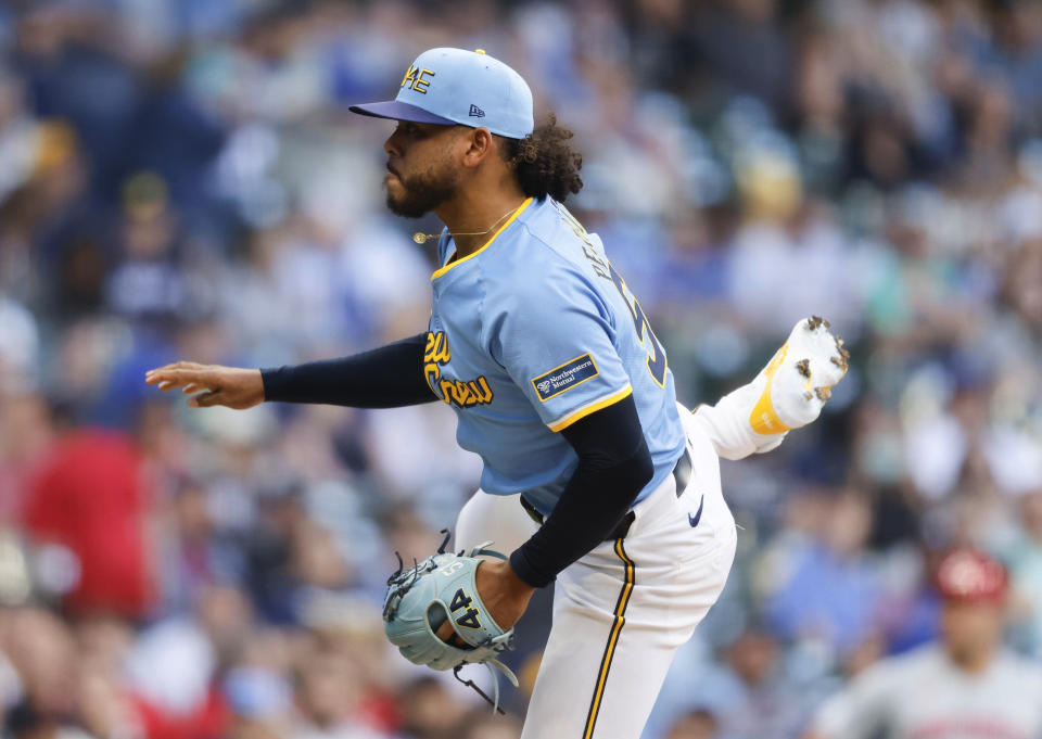 Milwaukee Brewers starting pitcher Freddy Peralta watches a throw to a Cincinnati Reds batter during the first inning of a baseball game Friday, June 14, 2024, in Milwaukee. (AP Photo/Jeffrey Phelps)