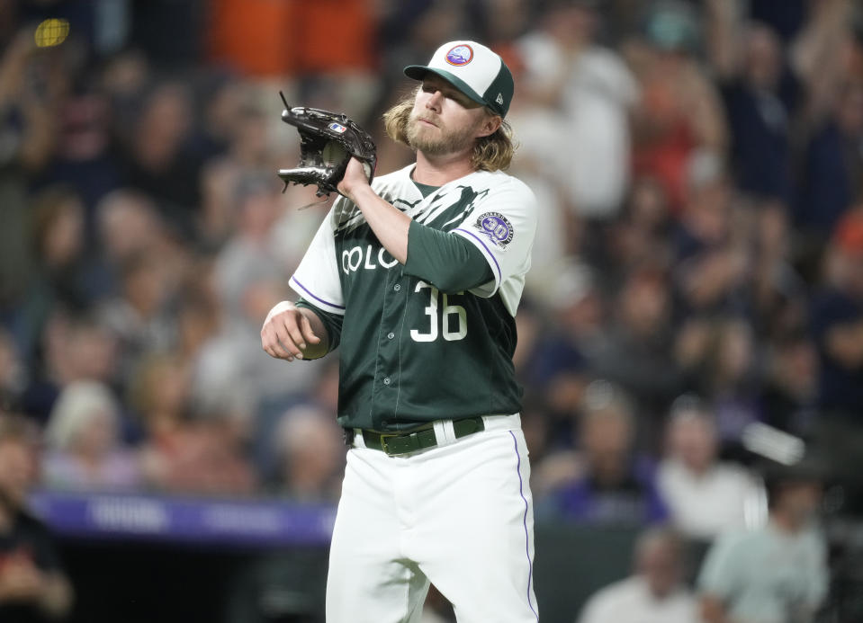 Colorado Rockies relief pitcher Pierce Johnson reacts after giving up a three-run home run to Detroit Tigers' Zach McKinstry in the 10th inning of a baseball game Saturday, July 1, 2023, in Denver. (AP Photo/David Zalubowski)