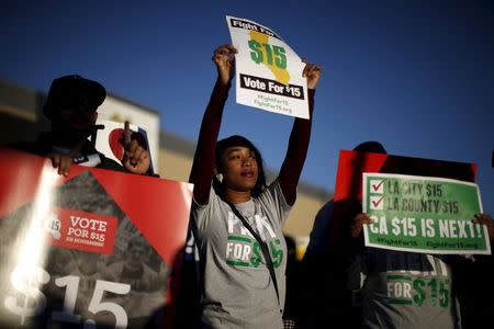 Fast-food workers and their supporters join a nationwide protest for higher wages and union rights outside McDonald's in Los Angeles, California, United States, November 10, 2015. REUTERS/Lucy Nicholson