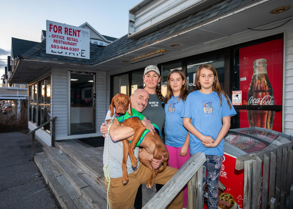 Jon and Sarah Gozzo pose with their twins, Maeve and Lyona, and their 2-year-old Vizsla dog, Tilli, in front of their new Secret Spot eatery location at 590 High Street. Their original location next door was destroyed by a fire on August 19, 2022.