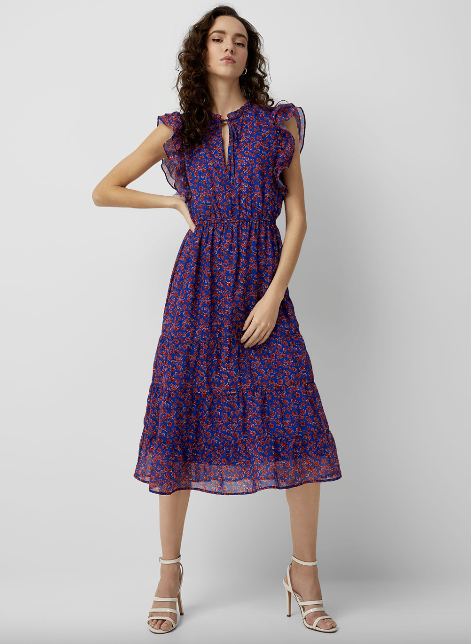 brunette model wearing purple, red and pink Icone Ruffled Floral Midi Dress (photo via Simons)