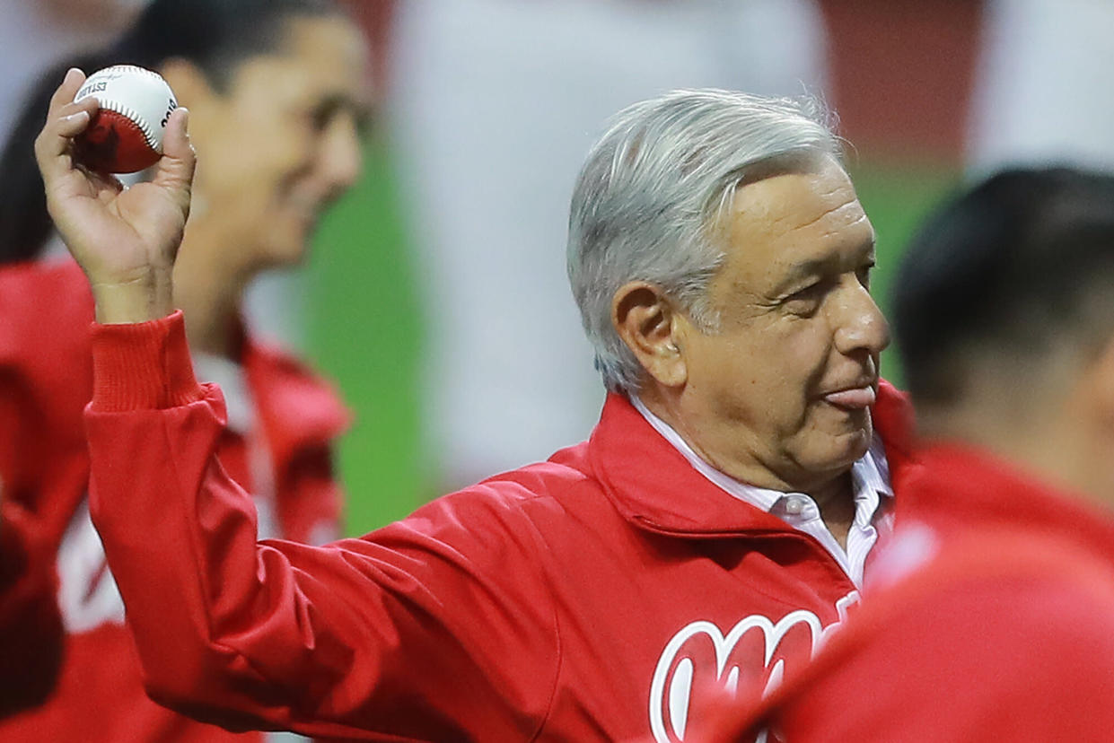 MEXICO CITY, MEXICO - MARCH 23: Andres Manuel Lopez Obrador, President of Mexico pitches the first ball prior a friendly game between San Diego Padres and Diablos Rojos at Alfredo Harp Helu Stadium on March 23, 2019 in Mexico City, Mexico. The game is held as part of the opening celebrations of the Alfredo Harp Helu Stadium, now the newest in Mexico to play baseball. (Photo by Hector Vivas/Getty Images)