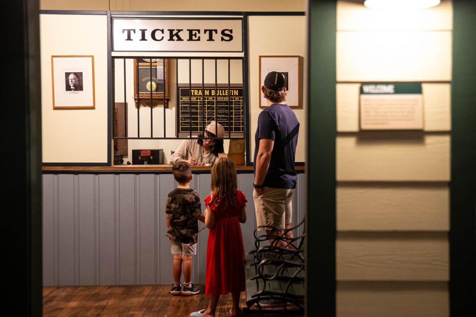 Museum Live actor Allison Major provides the experience of getting a 1910s train ticket to a family at the Corpus Christi Museum of Science and History on Aug. 13, 2022, in Corpus Christi, Texas. 