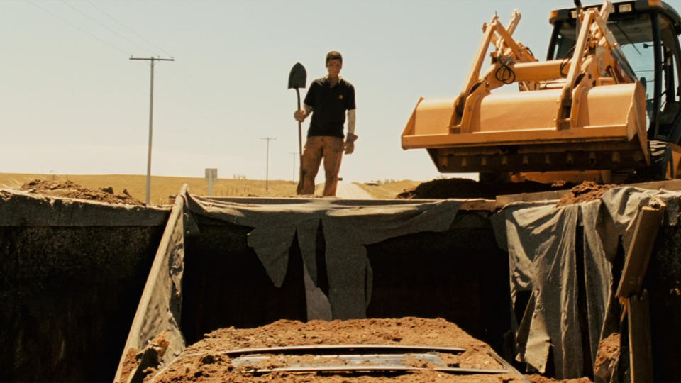 Wes Bentley over hole in Dolan's Cadillac